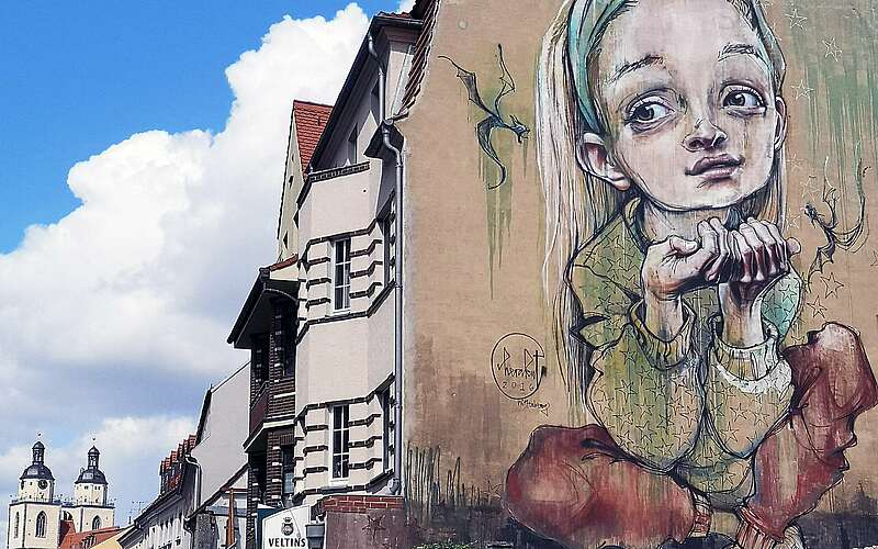 



    
        
                Street Art in Lutherstadt Wittenberg,
            
        
                Foto: Wittenberg Kultur e.V./Erhard Grodnick
            
    
